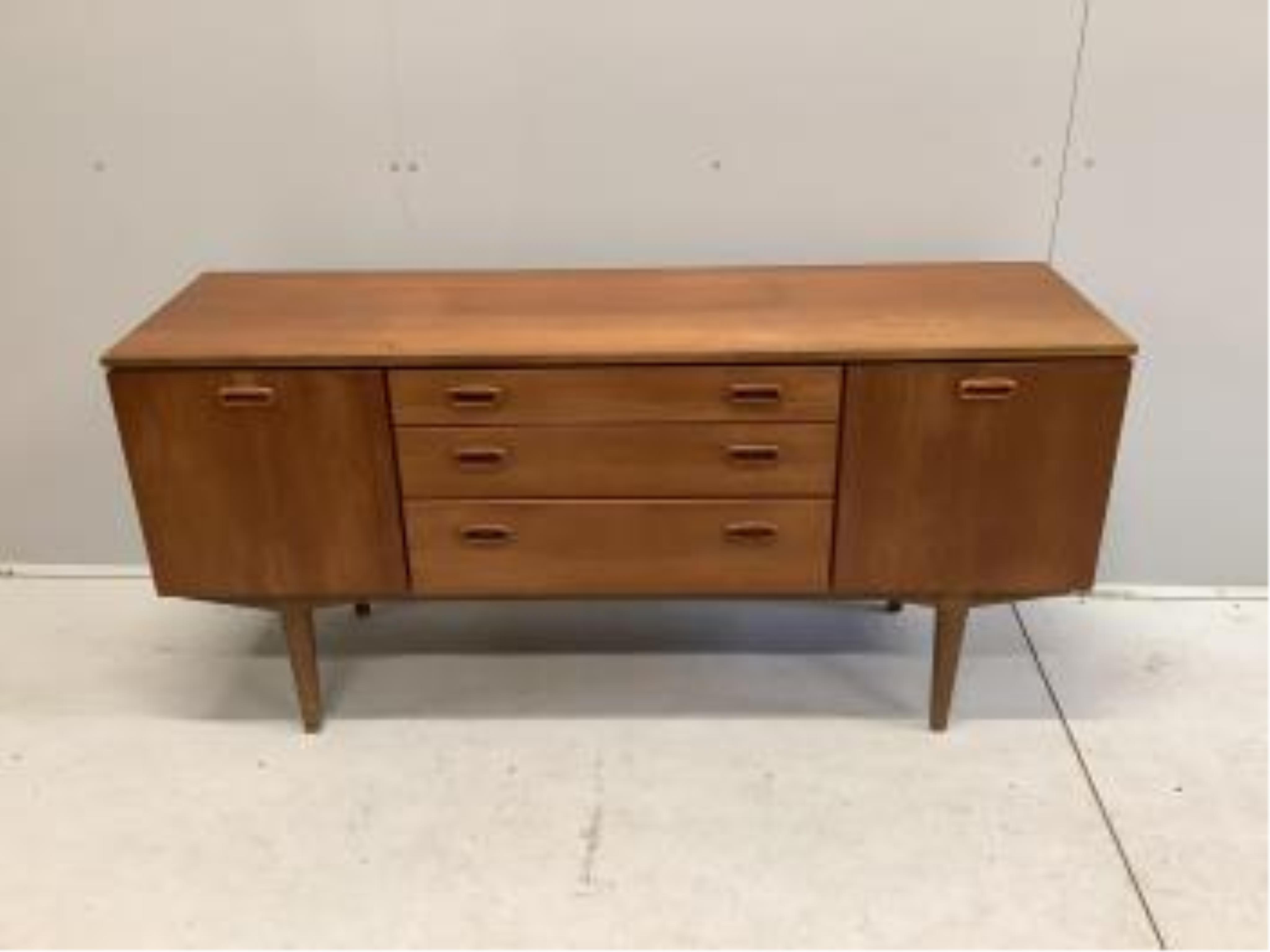 A mid century teak sideboard, probably Nathan Furniture, width 153cm, depth 44cm, height 72cm. Condition - fair